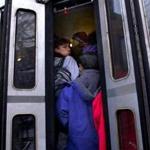 Commuters stood in the stairwell  of an overcrowded Riverside train in February.